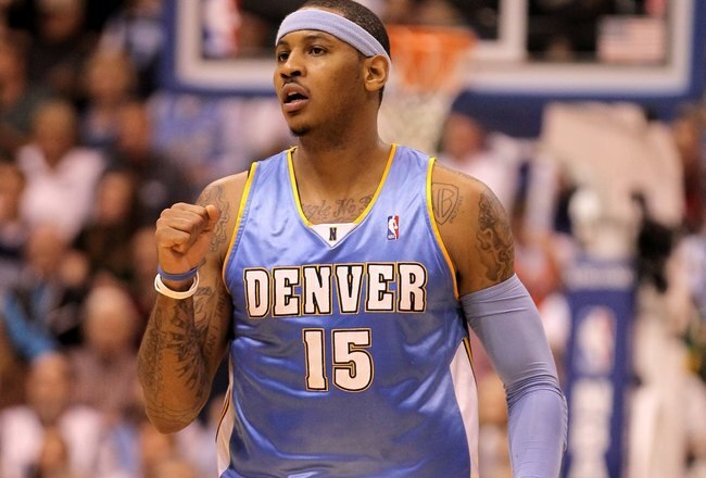 SALT LAKE CITY - APRIL 30:  Carmelo Anthony #15 of the Denver Nuggets pumps his fist during their game against the Utah Jazz in Game Six of the Western Conference Quarterfinals of the 2010 NBA Playoffs at EnergySolutions Arena on April 30, 2010 in Salt Lake City, Utah. NOTE TO USER: User expressly acknowledges and agrees that, by downloading and or using this photograph, User is consenting to the terms and conditions of the Getty Images License Agreement.  (Photo by Ezra Shaw/Getty Images)
