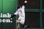 HOUSTON - MAY 19:  Left fielder Carlos Gonzalez #5 of the Colorado Rockies can't reach a hard hit ball by Tommy Manzella of the Houston Astros at Minute Maid Park on May 19, 2010 in Houston, Texas.  (Photo by Bob Levey/Getty Images)