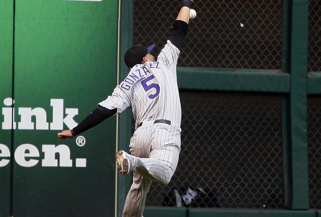 HOUSTON - MAY 19:  Left fielder Carlos Gonzalez #5 of the Colorado Rockies can't reach a hard hit ball by Tommy Manzella of the Houston Astros at Minute Maid Park on May 19, 2010 in Houston, Texas.  (Photo by Bob Levey/Getty Images)