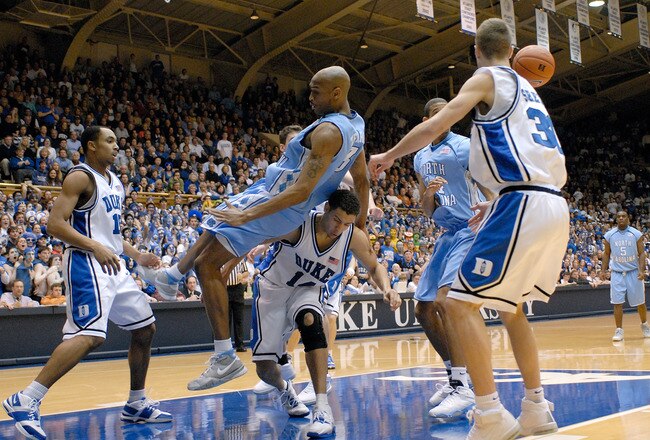 DURHAM, NC - FEBRUARY 07:  Reyshawn Terry #3 of the North Carolina Tar Heels flips over David McClure #14 of the Duke University Blue Devils  during their game on February 7, 2007 at Cameron Indoor Stadium in Durham, North Carolina.  (Photo by Grant Halverson/Getty Images)