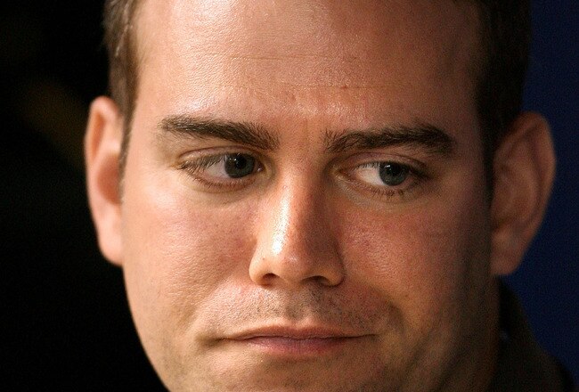 ST. PETERSBURG, FL - OCTOBER 11:  General manager Theo Epstein of the Boston Red Sox sits in the dugout before game two of the American League Championship Series against the Tampa Bay Rays during the 2008 MLB playoffs at Tropicana Field on October 11, 2008 in St. Petersburg, Florida.  (Photo by Elsa/Getty Images)
