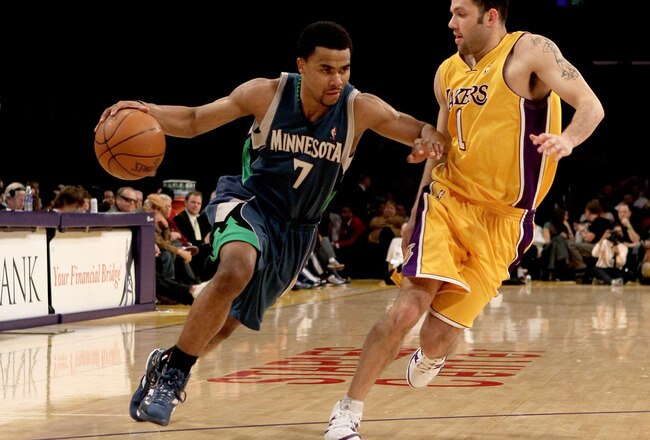LOS ANGELES - MARCH 19:  Ramon Sessions #7 of the Minnesota Timberwolves drives around Jordan Farmar #1 of the Los Angeles Lakers on March 19, 2010 at Staples Center in Los Angeles, California.  The Lakeres won 104-96. NOTE TO USER: User expressly acknowledges and agrees that, by downloading and/or using this Photograph, user is consenting to the terms and conditions of the Getty Images License Agreement. (Photo by Stephen Dunn/Getty Images)