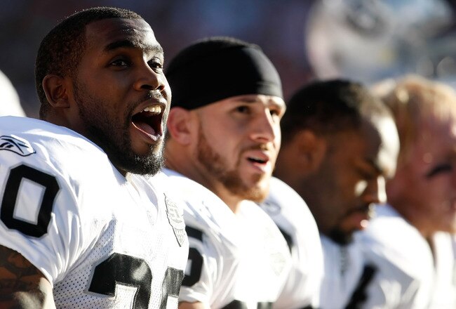 DENVER - DECEMBER 20:  Darren McFadden #20 of the Oakland Raiders reacts on the bench during the first half against the Denver Broncos at Invesco Field at Mile High on December 20, 2009 in Denver, Colorado. The Raiders defeated the Broncos 20-19.  (Photo by Jeff Gross/Getty Images)