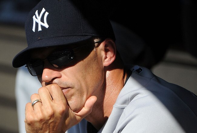 LOS ANGELES - JUNE 26:  Manager Joe Girardi of the New York Yankees watches the action from the dugout during the game against the Los Angeles Dodgers on June 26, 2010 at Dodger Stadium in Los Angeles, California.  (Photo by Lisa Blumenfeld/Getty Images)