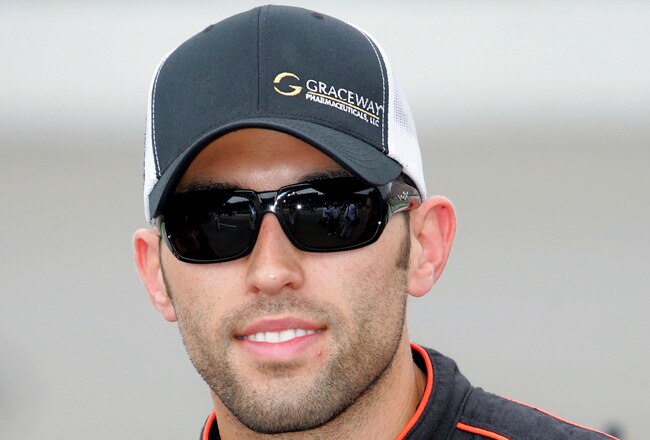 BROOKLYN, MI - JUNE 12:  Aric Almirola, driver of the #51 Zyclara / Graceway Pharmaceuticals Toyota, stands on the grid prior to the NASCAR Camping World Truck Series VFW 200 at Michigan International Speedway on June 12, 2010 in Brooklyn, Michigan.  (Photo by Jerry Markland/Getty Images for NASCAR)