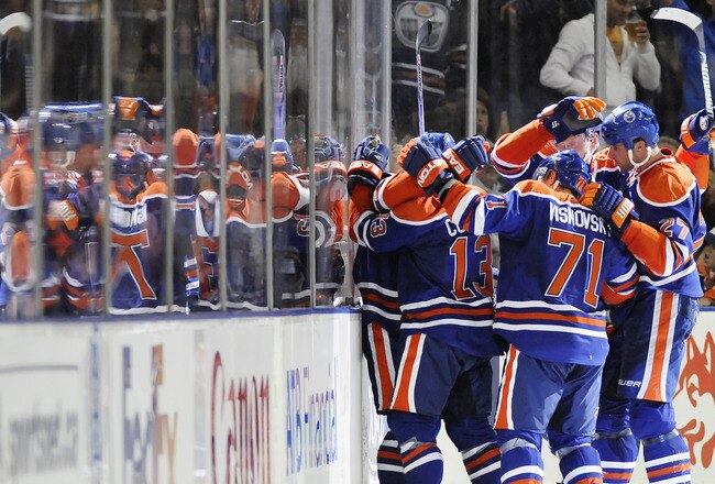 EDMONTON, AB - OCTOBER 3:  Gilbert Brule celebrates his goal with teammates (L-R) Andrew Cogliano, Lubomir Visnovsky, Ladislav Smid and Dustin Penner against the Calgary Flames in the second period during an NHL game on October 3, 2009 at Rexall Arena in Edmonton, Canada. L(Photo by Jimmy Jeong/Getty Images)