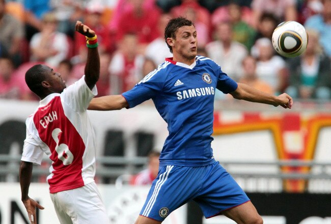 AMSTERDAM, NETHERLANDS - JULY 23:  Nemanja Matic of Chelsea pushs off Eyong Enoh of Ajax during a Pre-seson Friendly match between Chelsea and Ajax at Amsterdam Arena on July 23, 2010 in Amsterdam, Netherlands.  (Photo by Phil Cole/Getty Images)