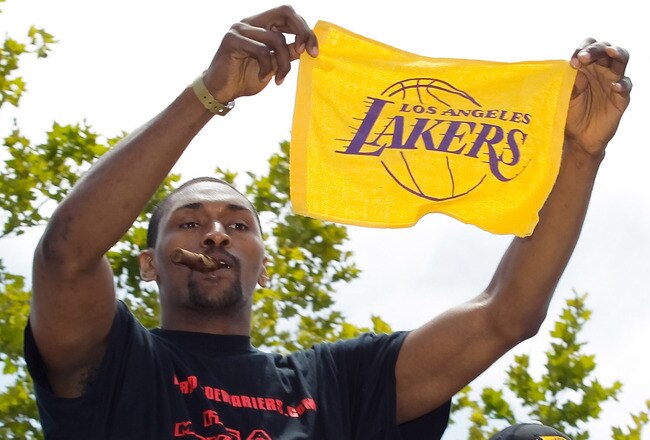 LOS ANGELES, CA - JUNE 21:  Los Angeles Lakers small forward Ron Artest salutes the crowd while riding in the victory parade for the the NBA basketball champion team on June 21, 2010 in Los Angeles, California. The Lakers beat the Boston Celtics 87-79 in 7 games for the franchise's 16 NBA title.  (Photo by Noel Vasquez/Getty Images)
