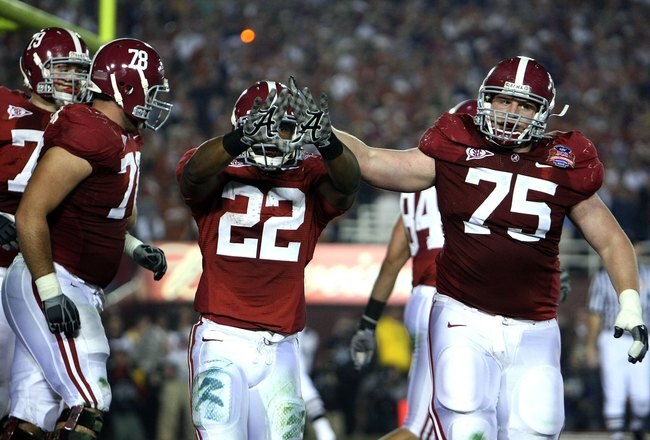 PASADENA, CA - JANUARY 07:  Running back Mark Ingram #22 of the Alabama Crimson Tide celebrates a touchdown with teammates against the Texas Longhorns in the second quarter of the Citi BCS National Championship game at the Rose Bowl on January 7, 2010 in Pasadena, California.  (Photo by Stephen Dunn/Getty Images)