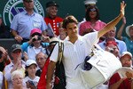 LONDON, ENGLAND - JUNE 30:  Roger Federer of Switzerland waves as he exits after losing his Quarter Final match against Tomas Berdych of Czech Republic on Day Nine of the Wimbledon Lawn Tennis Championships at the All England Lawn Tennis and Croquet Club on June 30, 2010 in London, England.  (Photo by Julian Finney/Getty Images)