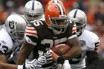 CLEVELAND - DECEMBER 27:  Jerome Harrison #35 of the Cleveland Browns runs by Tyvon Branch #33 of the Oakland Raiders at Cleveland Browns Stadium on December 27, 2009 in Cleveland, Ohio.  (Photo by Matt Sullivan/Getty Images)