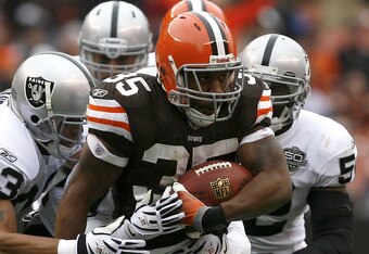 CLEVELAND - DECEMBER 27: Jerome Harrison #35 of the Cleveland Browns runs by Tyvon Branch #33 of the Oakland Raiders at Cleveland Browns Stadium on December 27, 2009 in Cleveland, Ohio. (Photo by Matt Sullivan/Getty Images)