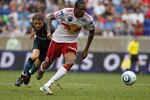 HARRISON, NJ - JULY 25:  Macoumba Kandji #10 of the New York Red Bulls plays the ball in front of Ben Mee #41 of Manchester City on July 25, 2010 at Red Bull Arena in Harrison, New Jersey. Red Bulls defeated Manchester City 2-1.  (Photo by Mike Stobe/Getty Images for New York Red Bulls)