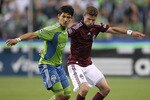 SEATTLE - JULY 25:  Fredy Montero #17 of the Seattle Sounders FC battles Drew Moor #3 of the Colorado Rapids on July 25, 2010 at Qwest Field in Seattle, Washington. (Photo by Otto Greule Jr/Getty Images)