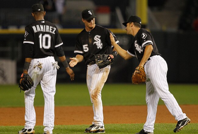 CHICAGO - JULY 07: (L-R) Alexei Ramirez #10, Gordan Beckham #15 and Omar Vizquel #11 of the Chicago White Sox celebrate a win over the Los Angeles Angels of Anaheim at U.S. Cellular Field on July 7, 2010 in Chicago, Illinois. The White Sox defeated the Angels 5-2. (Photo by Jonathan Daniel/Getty Images)