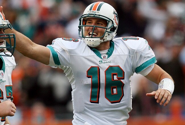 MIAMI - JANUARY 03:  Quarterback Tyler Thigpen #16 of the Miami Dolphins slaps the head of offensive lineman Joe Berger #67 to celebrate his touchdown pass to Davone Bess #15 against the Pittsburgh Steelers at Land Shark Stadium on January 3, 2010 in Miami, Florida. The Steelers defeated the Dolphins 30-24.  (Photo by Doug Benc/Getty Images)