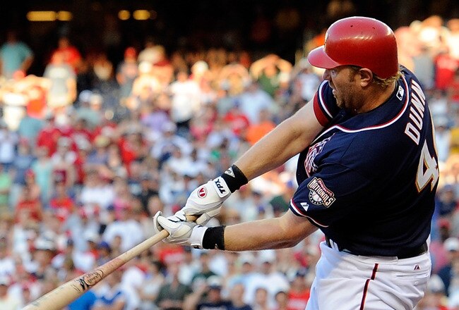 WASHINGTON - JULY 03:  Adam Dunn #44 of the Washington Nationals hits a double in the ninth inning to tie the game against the New York Mets at Nationals Park on July 3, 2010 in Washington, DC.  The Nationals won the game 6-5. (Photo by Greg Fiume/Getty Images)