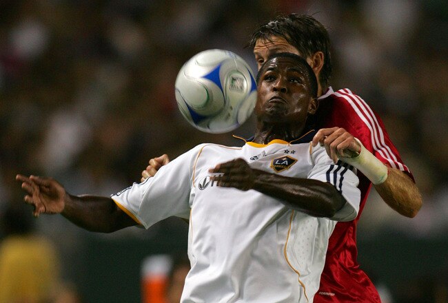 LOS ANGELES, CA - AUGUST 21:  Edson Buddle #14 of the Los Angeles Galaxy plays the ball off his chest as Brandon Prideaux #6 of the Chicago Fire defends the play in the first half during their MLS match at The Home Depot Center on August 21, 2008 in Carson, California.  (Photo by Victor Decolongon/Getty Images)