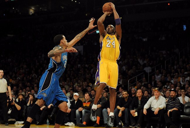 LOS ANGELES, CA - JANUARY 18:  Kobe Bryant #24 of the Los Angeles Lakers shoots against Matt Barnes #22 of the Orlando Magic in the first quarter during the game on January 18, 2010 at Staples Center in Los Angeles, California. NOTE TO USER: User expressly acknowledges and agrees that, by downloading and/or using this Photograph, user is consenting to the terms and conditions of the Getty Images License Agreement.  (Photo by Harry How/Getty Images)