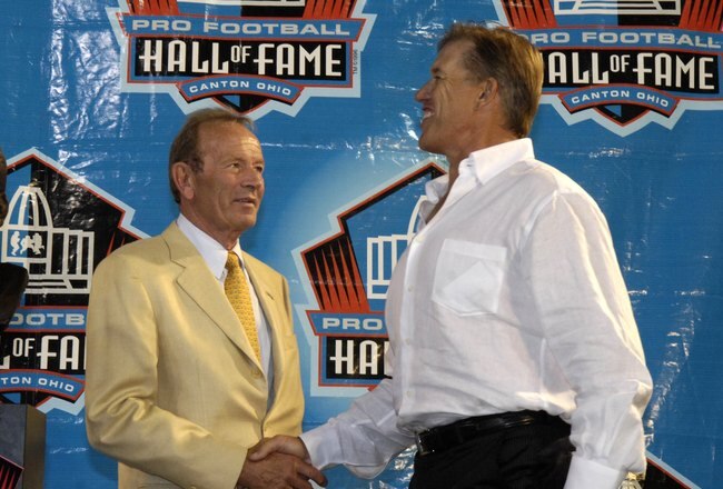 CANTON, OH - AUGUST 2: Owner Pat Bowlen (left) and John Elway of the Denver Broncos meet during the Class of 2008 Pro Football Hall of Fame Enshrinement Ceremony at Fawcett Stadium on August 2, 2008 in Canton, Ohio.   (Photo by Al Messerschmidt/Getty Images)