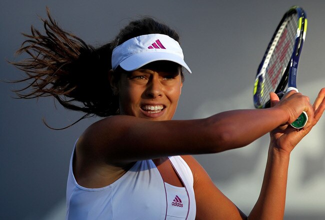 STANFORD, CA - JULY 26:  Ana Ivanovic of Serbia returns a shot against Alisa Kleybanova of Russia during Day 1 of the Bank of the West Classic at Stanford University on July 26, 2010 in Stanford, California.  (Photo by Jed Jacobsohn/Getty Images)