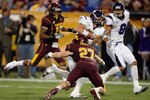 MINNEAPOLIS - NOVEMBER 01:  Eric Peterman #10 of the Northwestern Wildcats is tackled after a catch by Kyle Theret #27 of the Minnesota Golden Gophers during the first quarter at the Hubert H.Humphrey Metrodome on November 1, 2008 in Minneapolis, Minnesota  (Photo by Harry How/Getty Images)