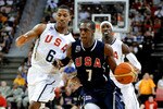 LAS VEGAS - JULY 24:  Rajon Rondo #7 of the 2010 USA Basketball Men's National Team dribbles in front of Derrick Rose #6 and Gerald Wallace #7 during a USA Basketball showcase at the Thomas & Mack Center on July 24, 2010 in Las Vegas, Nevada.  (Photo by Ethan Miller/Getty Images)