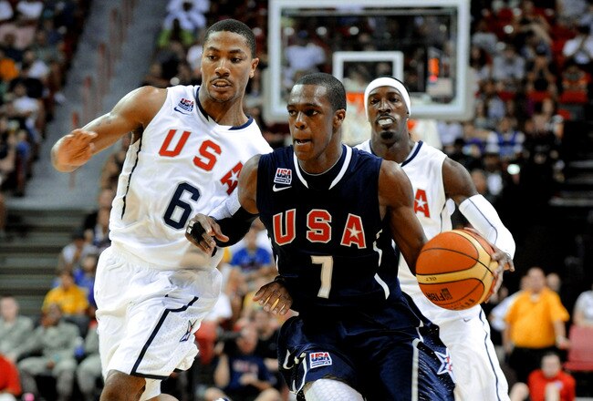 LAS VEGAS - JULY 24:  Rajon Rondo #7 of the 2010 USA Basketball Men's National Team dribbles in front of Derrick Rose #6 and Gerald Wallace #7 during a USA Basketball showcase at the Thomas & Mack Center on July 24, 2010 in Las Vegas, Nevada.  (Photo by Ethan Miller/Getty Images)