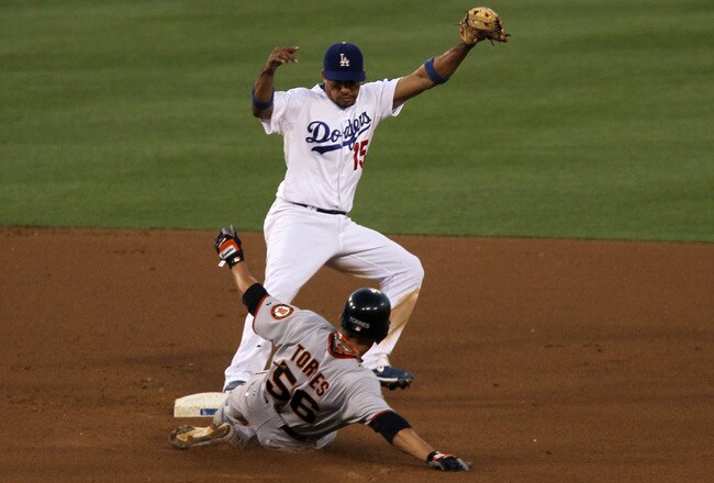 LOS ANGELES, CA - JULY 21:  Shortstop Rafael Furcal #15 of the Los Angeles Dodgers forces out Andres Torres #56 of the San Francisco Giants on July 21, 2010 at Dodger Stadium in Los Angeles, California.  The Dodgers won 2-0.  (Photo by Stephen Dunn/Getty Images)
