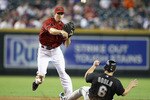 PHOENIX - JULY 11:  Infielder Stephen Drew #6 of the Arizona Diamondbacks throws over the sliding Dan Uggla #6 of the Florida Marlins to complete a double play during the fourth inning of the Major League Baseball game at Chase Field on July 11, 2010 in Phoenix, Arizona.  (Photo by Christian Petersen/Getty Images)