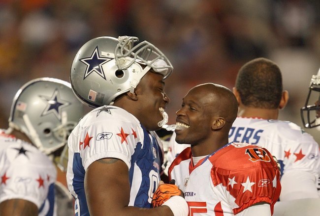 MIAMI GARDENS, FL - JANUARY 31: (L) DeMarcus Ware #94 of the Dallas Cowboys greets Chad Ochocinco #85 of the Cincinnati Bengals after the 2010 AFC-NFC Pro Bowl at Sun Life Stadium on January 31, 2010 in Miami Gardens, Florida. (Photo by Doug Benc/Getty Images)