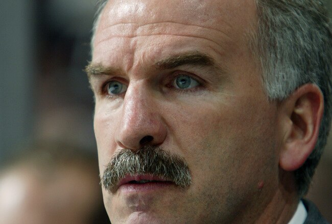 VANCOUVER - MARCH 13:  Head Coach Joel Quenneville of the St. Louis Blues looks on against the Vancouver Canucks during the NHL game at General Motors Place on March 13, 2003 in Vancouver, Canada.  The Blues and the Canucks skated to a 4-4 tie. (Photo by Jeff Vinnick/Getty Images/NHLI)