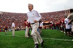 LOS ANGELES, CA - DECEMBER 05:  Coach Pete Carroll of the USC Trojans leads his team on to the field prior to the start of the NCAA college football game against Arizona Wildcats at the Los Angeles Coliseum on December 5, 2009 in Los Angeles, California.  (Photo by Kevork Djansezian/Getty Images)