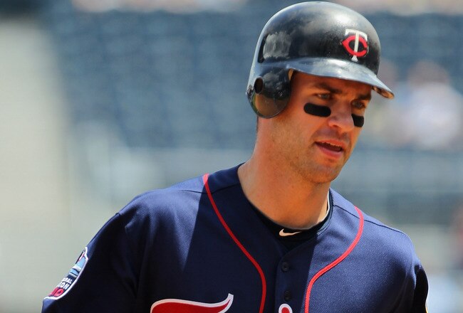 KANSAS CITY, MO - JULY 28:  Catcher Joe Mauer #7 of the Minnesota Twins runs toward 1st after a hit during the game against the Kansas City Royals on July 28, 2010 at Kauffman Stadium in Kansas City, Missouri.  (Photo by Jamie Squire/Getty Images)