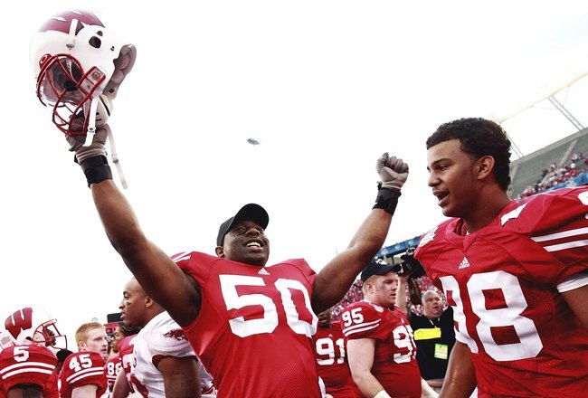 ORLANDO, FL - JANUARY 01:  Linebacker O'Brien Schofield #50 and Richard Garner #98 of the Wisconsin Badgers celebrate after defeating the Arkansas Razorbacks  in the Capitol One Bowl at Florida Citrus Bowl on January 1, 2007 in Orlando, Florida. Wisconsin defeated Arkansas 17-14.  (Photo by Doug Benc/Getty Images)