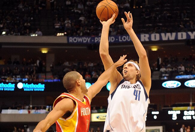 DALLAS - DECEMBER 18:  Forward Dirk Nowitzki #41 of the Dallas Mavericks takes a shot against Shane Battier#31 of the Houston Rockets on December 18, 2009 at American Airlines Center in Dallas, Texas.  NOTE TO USER: User expressly acknowledges and agrees that, by downloading and/or using this Photograph, user is consenting to the terms and conditions of the Getty Images License Agreement.  (Photo by Ronald Martinez/Getty Images)