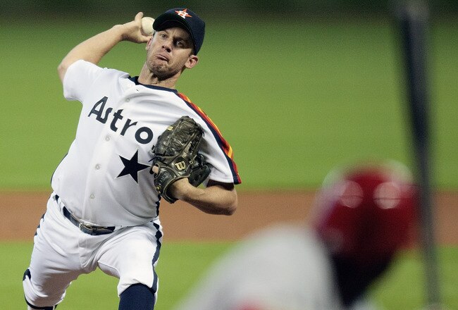 HOUSTON - JULY 24:  Pitcher Roy Oswalt #44 of the Houston Astros throws against the Cincinnati Reds in the first inning at Minute Maid Park on July 24, 2010 in Houston, Texas.  (Photo by Bob Levey/Getty Images)