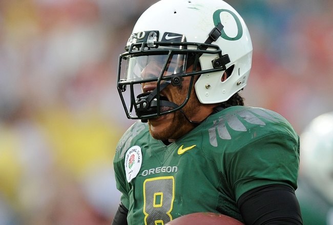 PASADENA, CA - JANUARY 01:  Quarterback Jeremiah Masoli #8 of the Oregon Ducks celebrates after scoring a touchdown against the Ohio State Buckeyes in the 96th Rose Bowl game on January 1, 2010 in Pasadena, California.  (Photo by Kevork Djansezian/Getty Images)