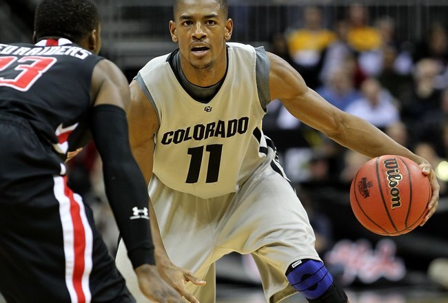 KANSAS CITY, MO - MARCH 10:  Cory Higgins #11 of the Colorado Buffaloes moves the ball against the Texas Tech Red Raiders in the first half during the first round game of the 2010 Phillips 66 Big 12 Men's Basketball Tournament at the Sprint Center on March 10, 2010 in Kansas City, Missouri.  (Photo by Jamie Squire/Getty Images)