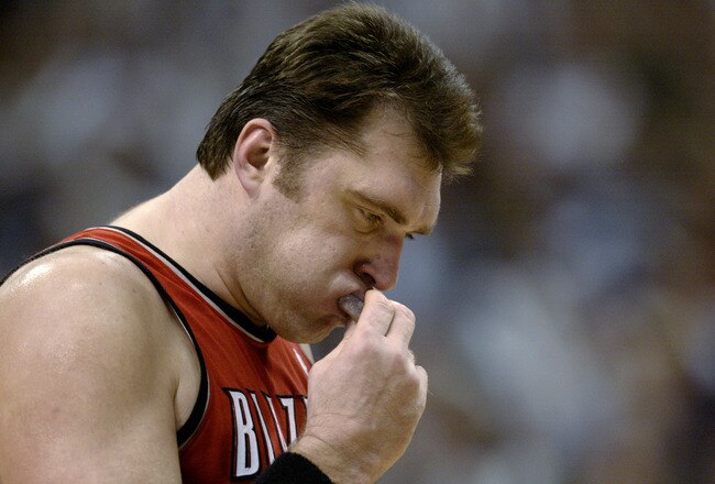 DALLAS - MAY 4:  Arvydas Sabonis #11 of the Portland Trail Blazers removes his mouth guard in Game seven of the Western Conference Quarterfinals against the Dallas Mavericks during the 2003 NBA Playoffs at American Airlines Center on May 4, 2003 in Dallas, Texas.  The Mavericks won 107-95.  NOTE TO USER: User expressly acknowledges and agrees that, by downloading and/or using this Photograph, User is consenting to the terms and conditions of the Getty Images License Agreement. (Photo by Brian Bahr/Getty Images)