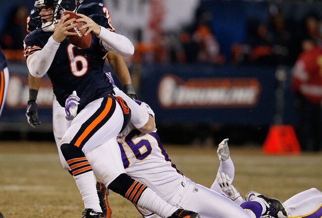 CHICAGO - DECEMBER 28: Jay Cutler #6 of the Chicago Bears is sacked by Brian Robison #96 of the Minnesota Vikings at Soldier Field on December 28, 2009 in Chicago, Illinois. The Bears defeated the Vikings 36-30 in overtime. (Photo by Jonathan Daniel/Getty Images)