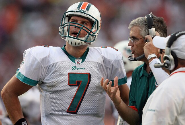 MIAMI - DECEMBER 06:  Quarterback Chad Henne #7 of the Miami Dolphins talks with offensive coordinator Dan Henning and head coach Tony Sparano late in the game against the New England Patriots at Land Shark Stadium on December 6, 2009 in Miami, Florida. The Dolphins defeated the Patriots 22-21.  (Photo by Doug Benc/Getty Images)