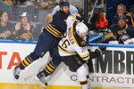 BUFFALO, NY - APRIL 15: Matt Ellis #37  of the Buffalo Sabres and Blake Wheeler #26 of the Boston Bruins collide in Game One of the Eastern Conference Quarterfinals during the 2010 NHL Stanley Cup Playoffs at HSBC Arena on April 15, 2010  in Buffalo, New York.  (Photo by Rick Stewart/Getty Images)