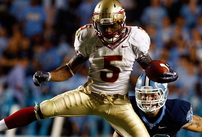 CHAPEL HILL, NC - OCTOBER 22:  Greg Reid #5 of the Florida State Seminoles leaps over North Carolina Tar Heels defenders Kennedy Tinsley #36 and Hunter Furr, #40 at Kenan Stadium on October 22, 2009 in Chapel Hill, North Carolina.  (Photo by Scott Halleran/Getty Images)