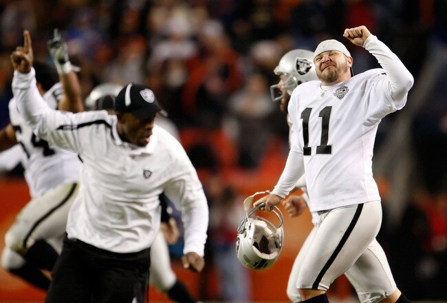 DENVER - DECEMBER 20:  Sebastian Janikowski (R) #11 of the Oakland Raiders celebrates a victory over the Denver Broncos at Invesco Field at Mile High on December 20, 2009 in Denver, Colorado. The Raiders defeated the Broncos 20-19.  (Photo by Jeff Gross/Getty Images)