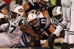SAN DIEGO - JANUARY 17:  Quarterback Philip Rivers #17 of the San Diego Chargers scores a touchdown against the New York Jets in the fourth quarter of the AFC Divisional Playoff Game at Qualcomm Stadium on January 17, 2010 in San Diego, California.  (Photo by Donald Miralle/Getty Images)