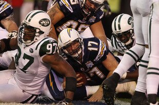 SAN DIEGO - JANUARY 17:  Quarterback Philip Rivers #17 of the San Diego Chargers scores a touchdown against the New York Jets in the fourth quarter of the AFC Divisional Playoff Game at Qualcomm Stadium on January 17, 2010 in San Diego, California.  (Photo by Donald Miralle/Getty Images)