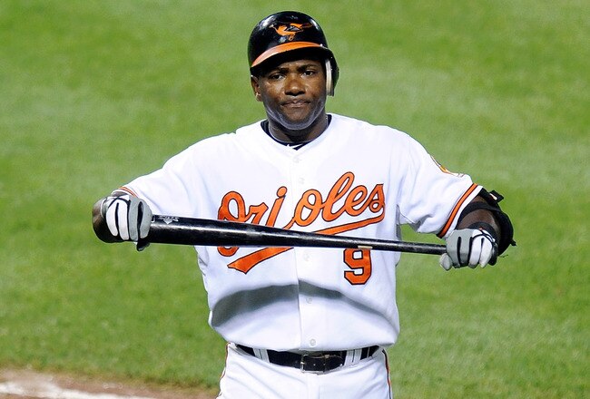 BALTIMORE - JULY 22:  Miguel Tejada #9 of the Baltimore Orioles reacts after flying out in the sixth inning against the Minnesota Twins at Camden Yards on July 22, 2010 in Baltimore, Maryland.  (Photo by Greg Fiume/Getty Images)