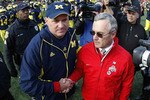 ANN ARBOR, MI - NOVEMBER 21: Head coach Jim Tressel of the Ohio State Buckeyes shakes hands after a 21-10 victory with head coach Rich Rodriguez of the Michigan Wolverines on November 21, 2009 at Michigan Stadium in Ann Arbor, Michigan.  (Photo by Gregory Shamus/Getty Images)