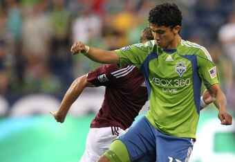 SEATTLE - JULY 25:  Fredy Montero #17 of the Seattle Sounders FC battles Drew Moor #3 of the Colorado Rapids on July 25, 2010 at Qwest Field in Seattle, Washington. (Photo by Otto Greule Jr/Getty Images)